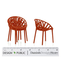 Set of two modern chairs featuring a vibrant orange color and a unique, woven pattern design.