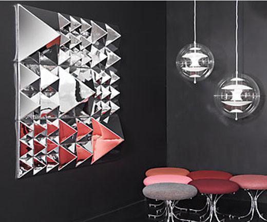"Modern geometric wall art featuring silver and red triangular patterns on a sleek black background."