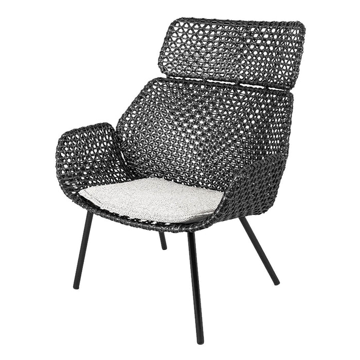 Black woven chair with a patterned backrest and contrasting white seat cushion, perfect for modern decor.