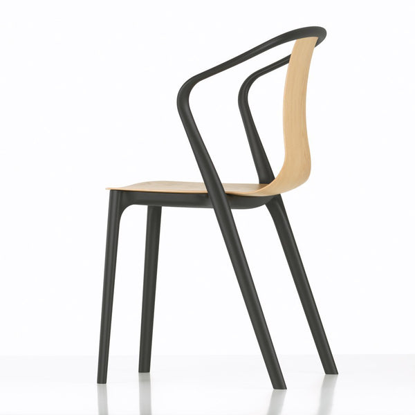 Modern chair featuring a sleek black frame and a natural wood seat, showcasing a minimalist design with clean lines.