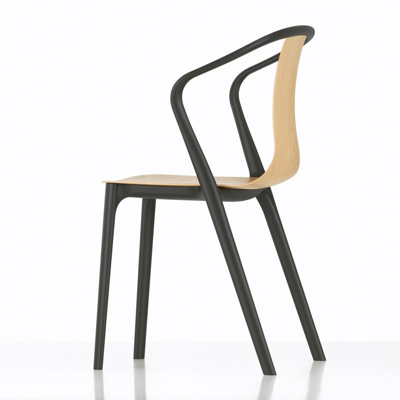 Modern chair featuring a sleek black frame and a natural wood seat, showcasing a minimalist design with clean lines.