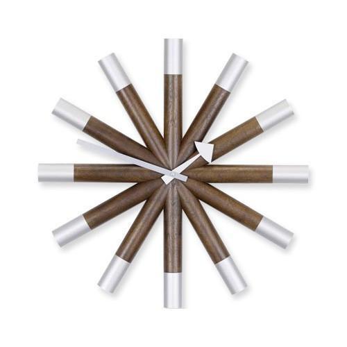 Brown wood-patterned markers with silver tips arranged in a circular layout, showcasing a modern design.