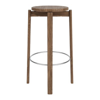 Brown wooden bar stool with a round seat and sleek legs, featuring a minimalist design and silver footrest.