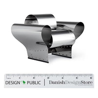 Stylish metallic chair with a sleek silver finish and unique curved design elements. Perfect for modern decor.