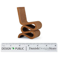 "Unique brown twisted chair design with a textured surface and smooth curves, perfect for modern decor."