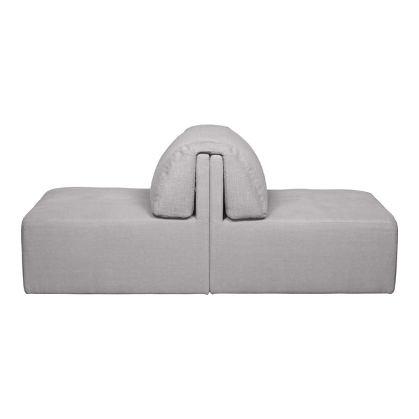Gray modular sofa with a smooth texture and rounded cushion, perfect for modern living spaces.