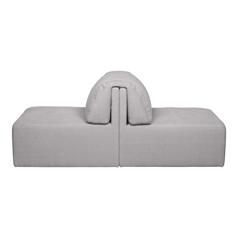 Gray modular sofa with a smooth texture and rounded cushion, perfect for modern living spaces.