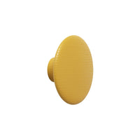 Round yellow knob with a smooth, textured surface, perfect for adding a pop of color to furniture.