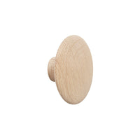 Natural wood knob in a smooth, round design with a light oak finish. Perfect for minimalist decor.