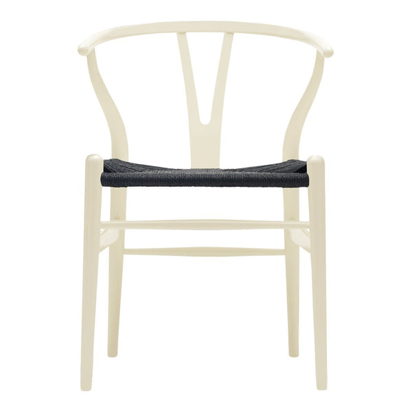 Beige chair with a minimalist design and a dark gray seat cushion, featuring clean lines and a modern aesthetic.