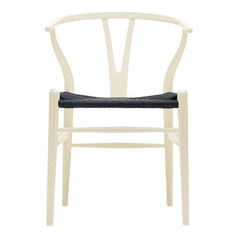 Beige chair with a minimalist design and a dark gray seat cushion, featuring clean lines and a modern aesthetic.