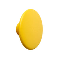 Bright yellow circular knob with a smooth, matte finish, ideal for modern home decor.